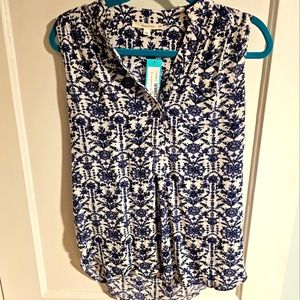 Blue & white, sleeveless, v-neck blouse.